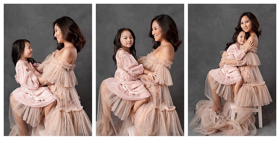 mother with her child in pink dresses