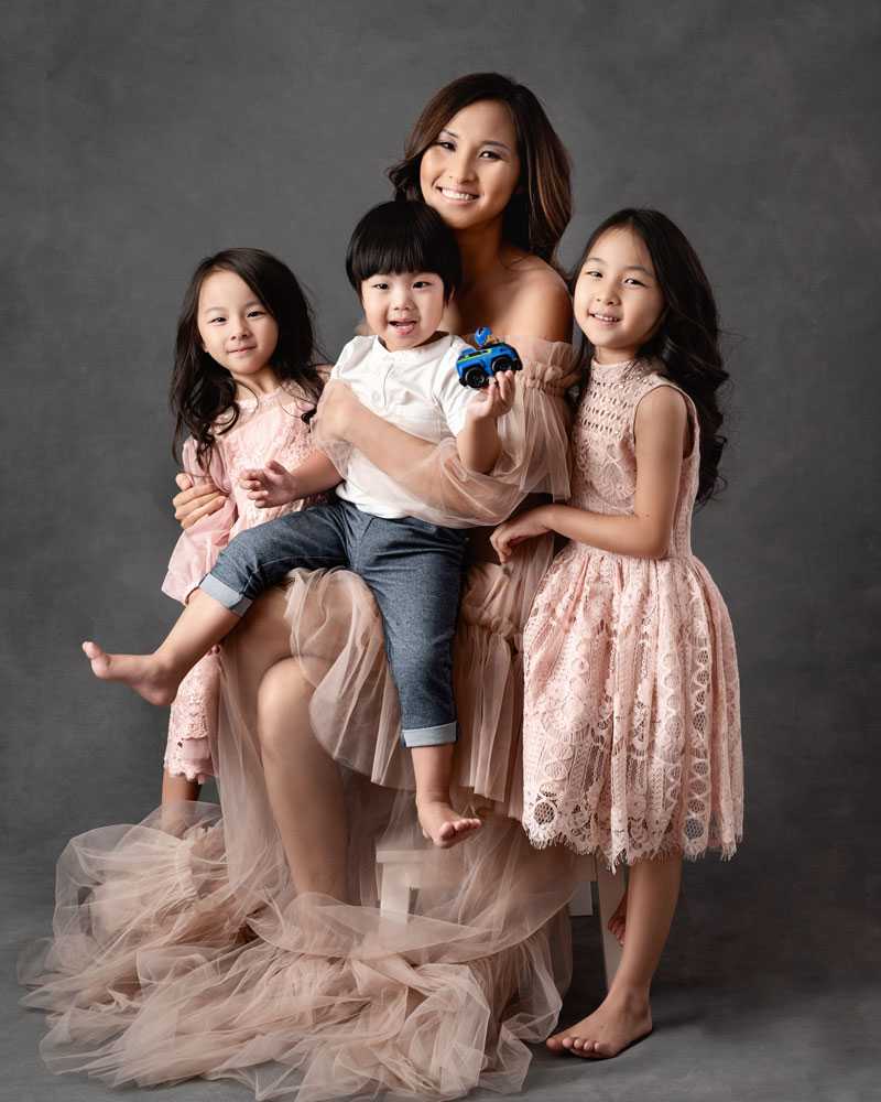 mother with her three children posing for mummy and me photo