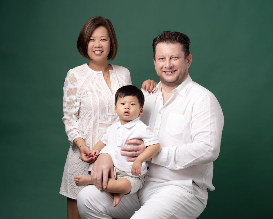 Family portrait with green background
